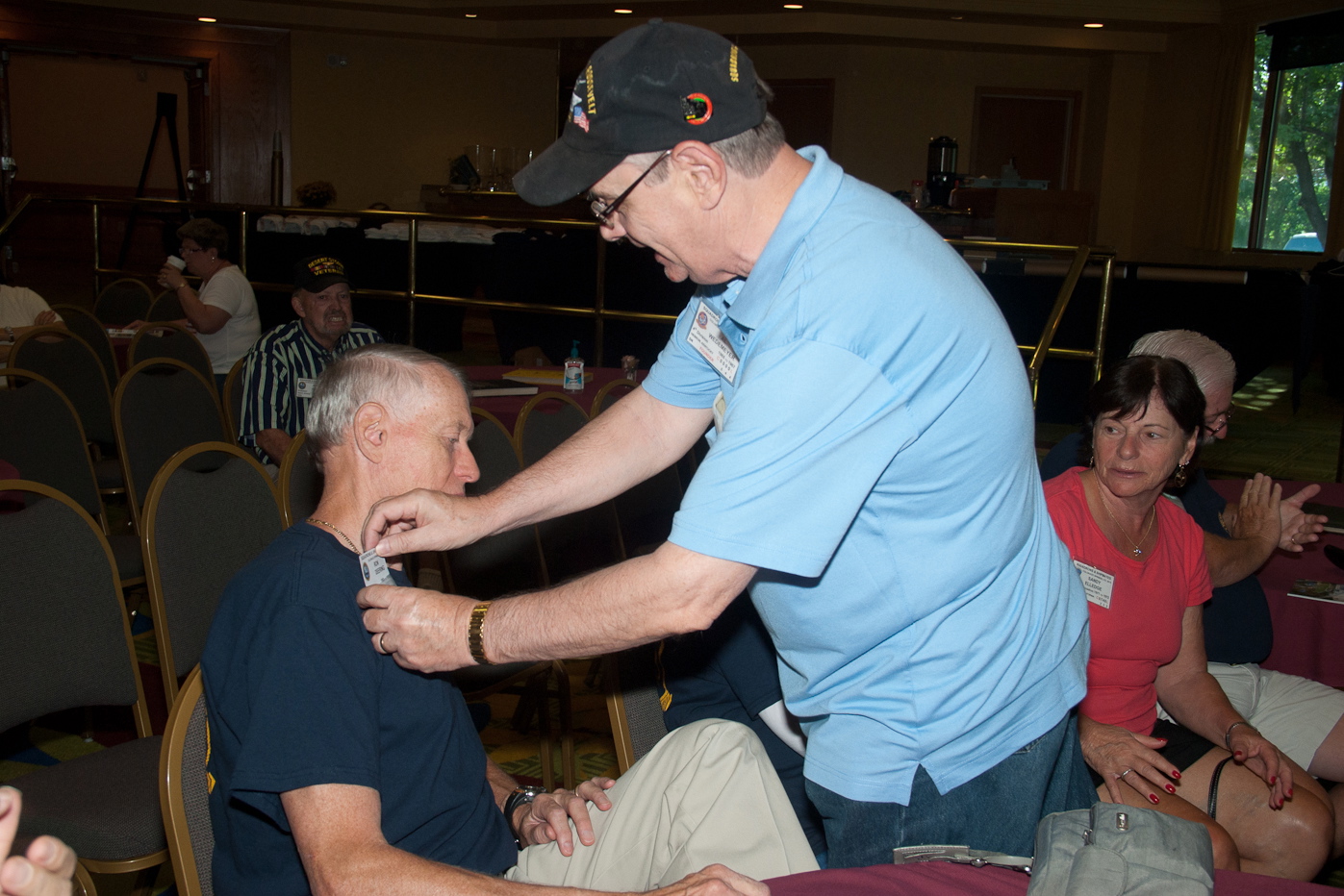 Al giving Ron Deering his new Name Badge after becoming a Lifetime Member