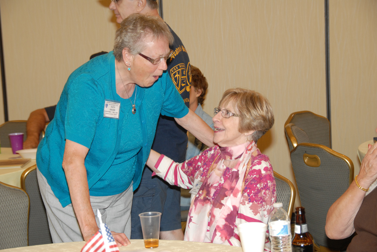 Patty Gruver talking with Gloria Bjorkman