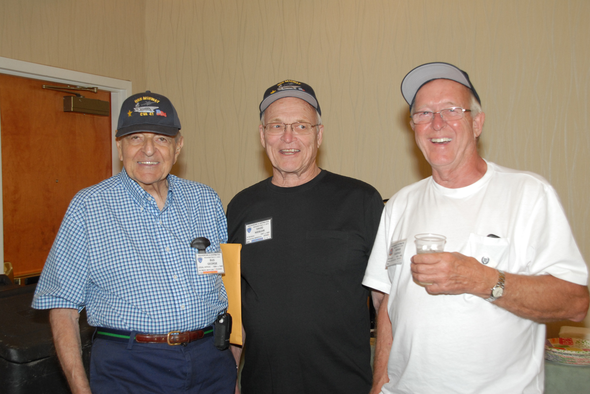 Bud George and David Niebuhr of USS Midway and Vice-President Morrie Saxerud of USS FDR