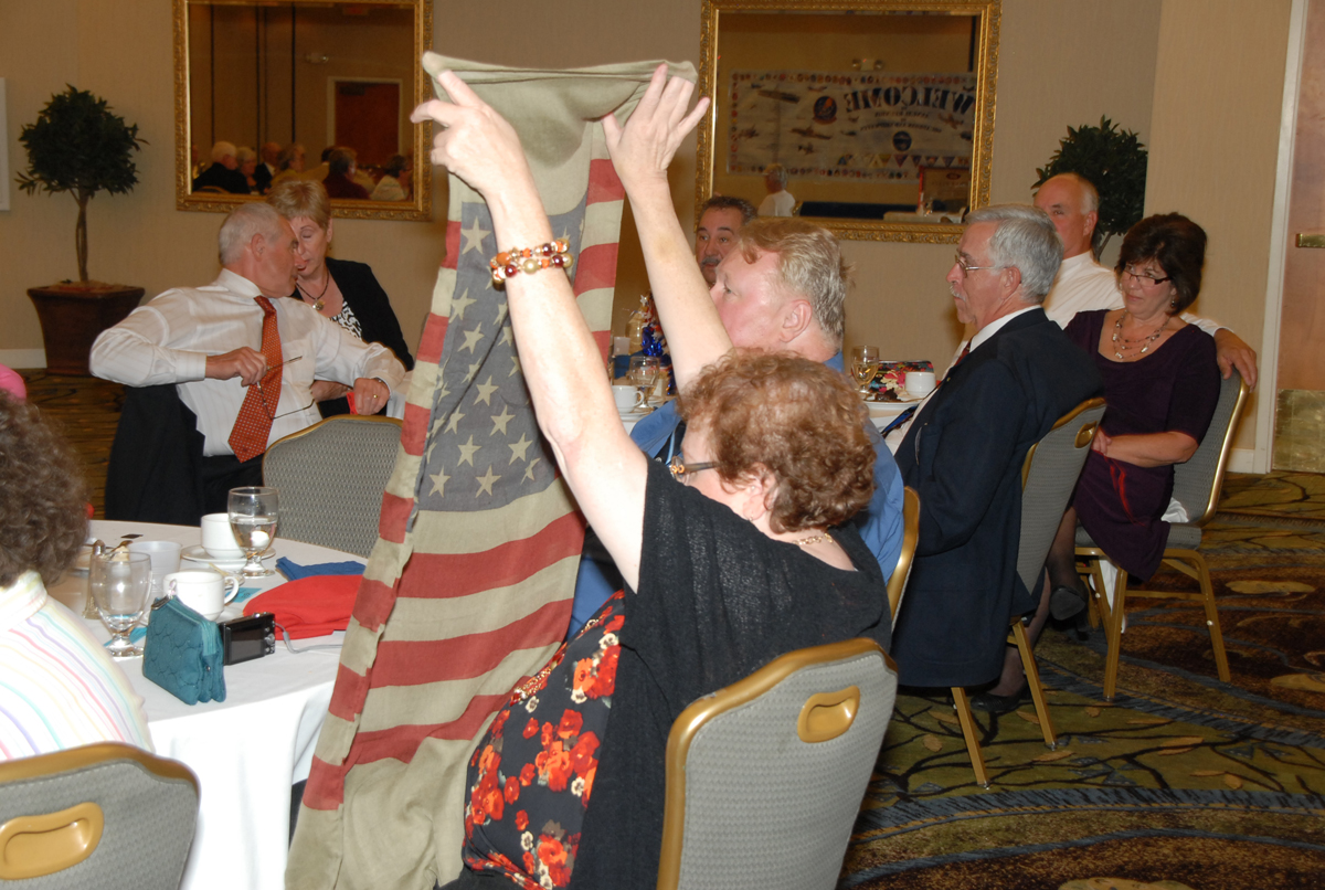 Arlette Plesko of USS Midway wins a patriotic scarf